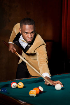 Young Man playing Billard
