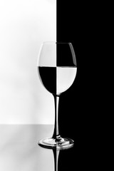 Wineglass on a black and white background, distortion