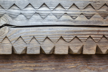 Carved wooden antique texture. Ethnic background. Element of ancient Ukrainian architecture.