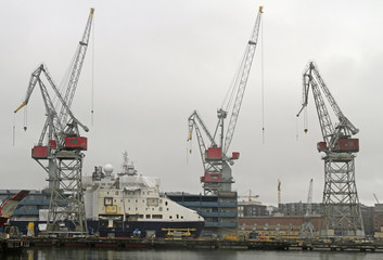 Fototapeta na wymiar Harbor cranes in sea cargo port in Helsinki