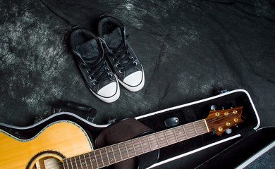 Fototapeta premium Acoustic guitar in a case on dark background