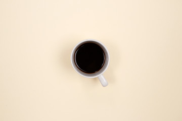 Coffee cup on beige background. Flat lay, Top view. Minimal style.