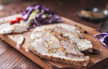 Pork ham, baked in the oven and a green salad. Healthy diet. Dietary meat. Close up. Spring salad with meat. Horizontal. Close up. Place for text.  Deadpan