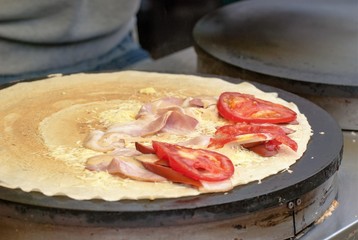 Waffle or crepe is pancake batter baked in a waffle iron.Method thin cake baked and then rolled at homemade bakery restaurant.