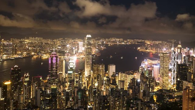 a night panning timelapse of victoria harbour and hong kong island from the peak in hong kong, china