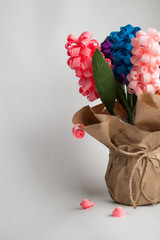 paper hyacinths in a vase of paper on a white background, gift, pink, blue, purple, orange, handmade, flowers from corrugated paper