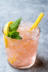 Pink Cocktail with Crushed Ice, Mint and Lemon
