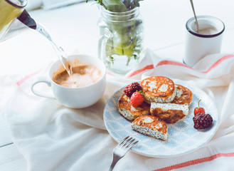 syrniki with poppy seeds on a wooden surface. concept of a healthy breakfast