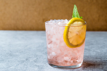 Pink Cocktail with Crushed Ice, Mint and Lemon
