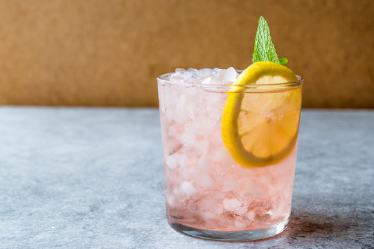 Pink Cocktail with Crushed Ice, Mint and Lemon
