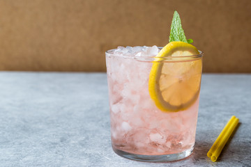 Pink Cocktail with Crushed Ice, Mint and Lemon