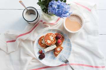 syrniki with poppy seeds on a wooden surface. concept of a healthy breakfast