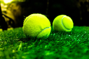 Tennis ball on artificial grass
