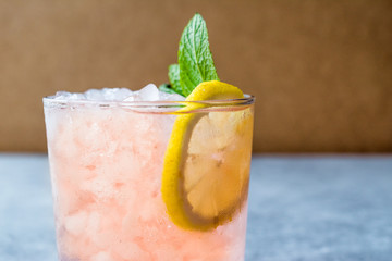 Pink Cocktail with Crushed Ice, Mint and Lemon
