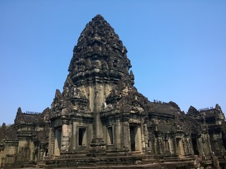 Fototapeta premium Angkor Wat in Siem Reap, Cambodia. Ancient Khmer stone temple ruins in jungle forest