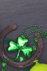 Lucky horse shoe with St Patrick's day green clover decorations