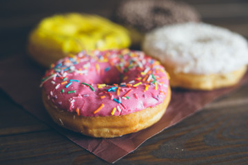 Homemade colorful donuts close up