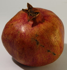 A fruit of pomegranate close-up.