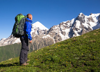 Fototapeta na wymiar Happy hiker relax on beautiful mountains landscape
