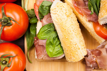 Sandwiches on wooden board in studio photo