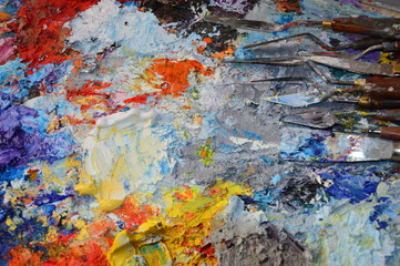A painter's palette in his workshop with tools