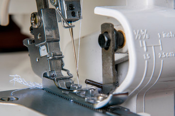 Modern Sewing machine with light flower pattern fabric.
