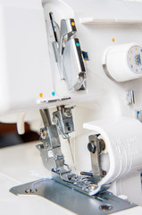 Modern Sewing machine with light flower pattern fabric.