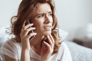 What are you talking about. Irritated lady looking into vacancy while sitting at home and listening...