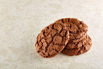 Closeup shallow depth of field picture of freshly baked chocolate chip cookies on burlap napkin.