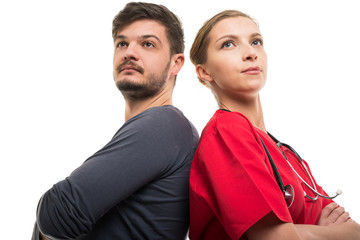 Low angle of patient with doctor standing back to back.