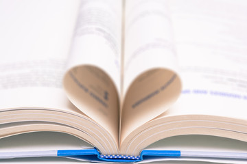 Love learning. Open book with folded pages