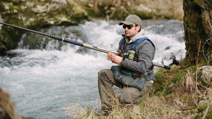  Trout sport fishing in the stream