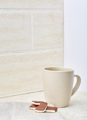 Close-up white cup of coffee with chocolate on white background, top view