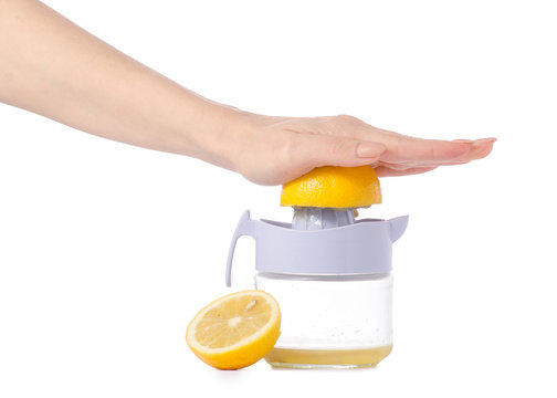 Juicer lemon juice in hands
