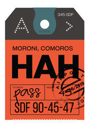 Naklejka premium Moroni airport luggage tag. Realistic looking tag with stamp and information written by hand. Design element for creative professionals.