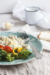 Homemade Breakfast with scramble, broccoli and red pepper. Healthy diet. Dietary meat. Close up.