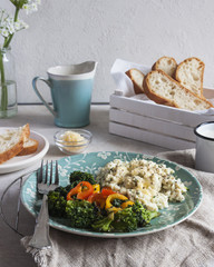 Breakfast buffet with eggs, toast, and a bowl with cheese, selective focus. Dietary meat. Close up.