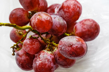 red grapes close up on light background