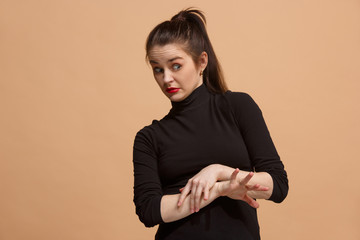 Young woman with disgusted expression repulsing something, isolated on the pastel