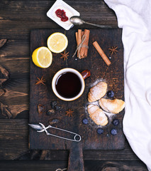 cup of black tea, and yogurt on a brown board