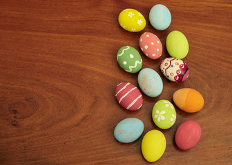 happy easter eggs on wooden