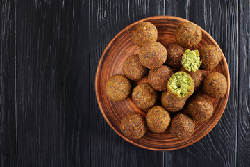 Falafel balls on a clay plate