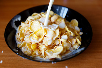 Corn flakes with milk. Healthy food in the morning