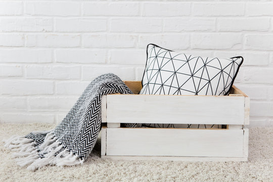 White wooden box pillow plaid