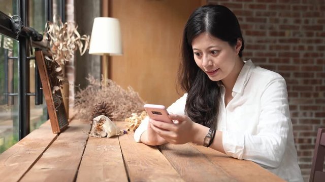 woman texting aside the cafe coffee shop.
