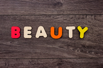 Naklejka premium Beauty word from wooden letters
