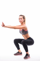 Fototapeta na wymiar sport fitness woman, young healthy girl doing squat exercises, full length portrait over white background
