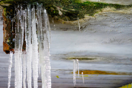 Ice stalactites under the bridge