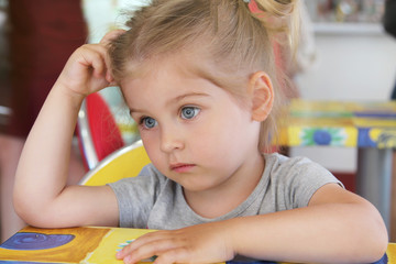Portrait of a cute, thoughtful child. frustrated child