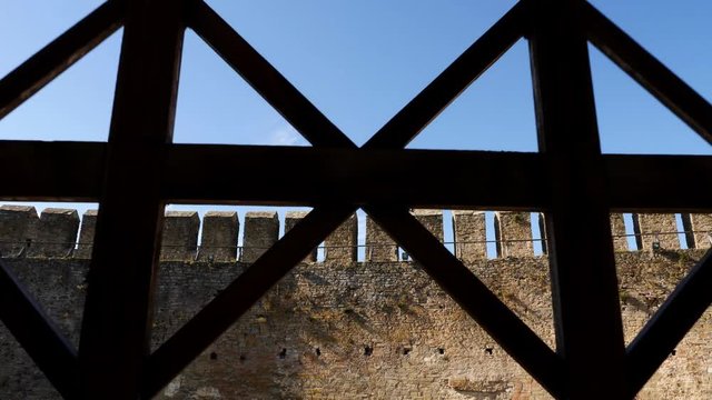Camera movement back from wall to inside view of old the Khotyn Fortress.